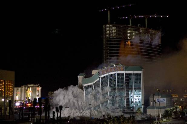 The New Frontier Atrium Tower starts to fall as it is imploded Nov. 13, 2007. 